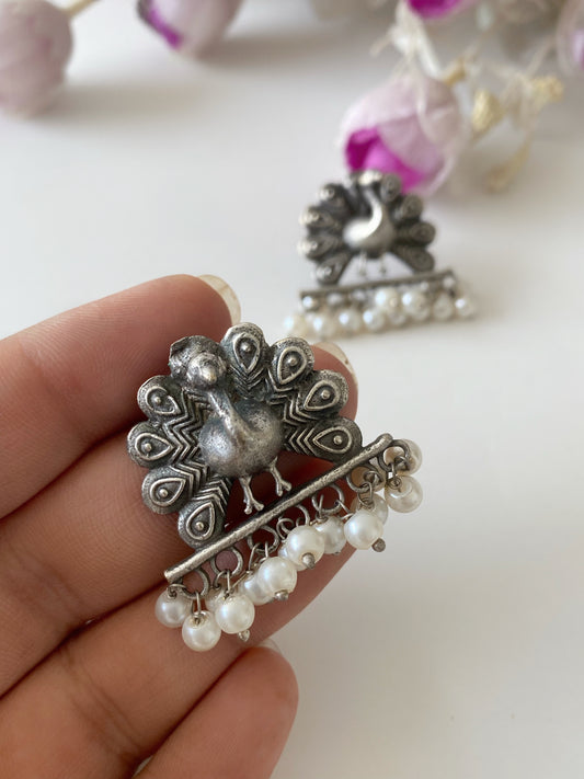 SILVERLOOKALIKE PEACOCK STUDS
